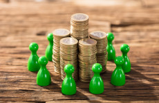 Stack Of Coins With Green Figures
